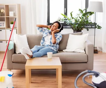 customer listening music while house cleaning service